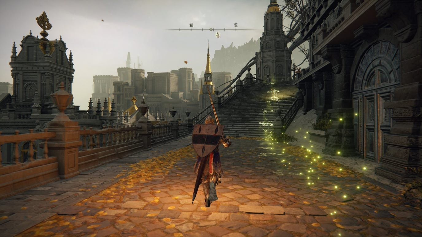 A warrior follows a trail of yellow light up a flight of stairs in Leyndell Royal Capital in Elden Ring.