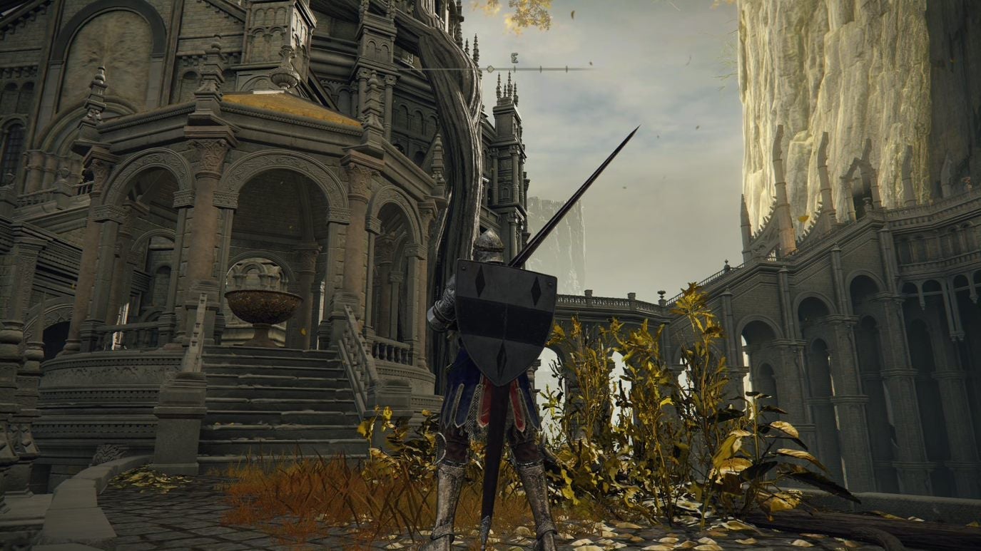 A warrior stands in front of a small courtyard in Leyndell Royal Capital in Elden Ring.