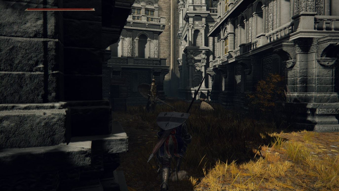 A warrior goes down a shady dead-end in Leyndell, Royal Capital in Elden Ring.
