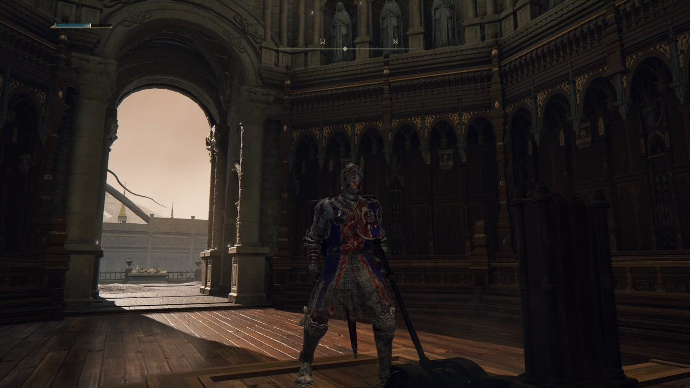 A warrior stands inside an arched doorway in Leyndell, Royal Capital in Elden Ring.