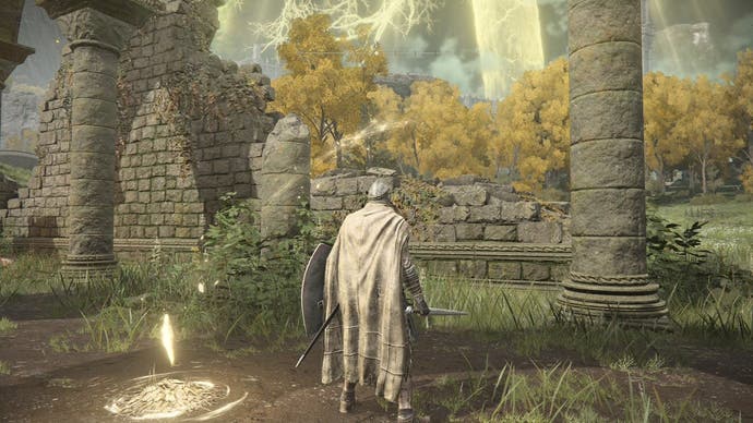 A warrior stands inside the ruins of a church in Elden Ring
