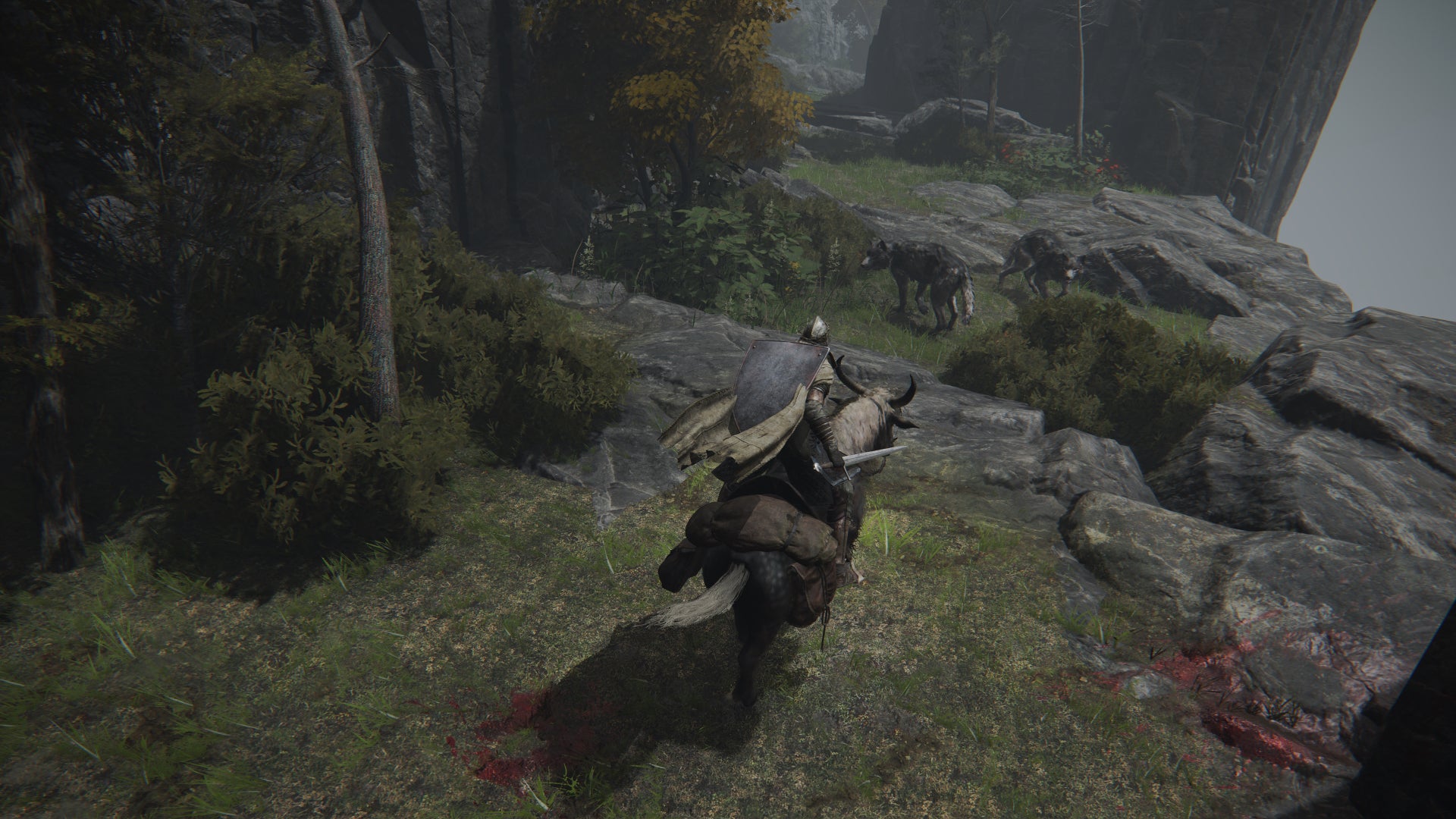 The player in Elden Ring faces off against two Wolves while on horseback. - 6