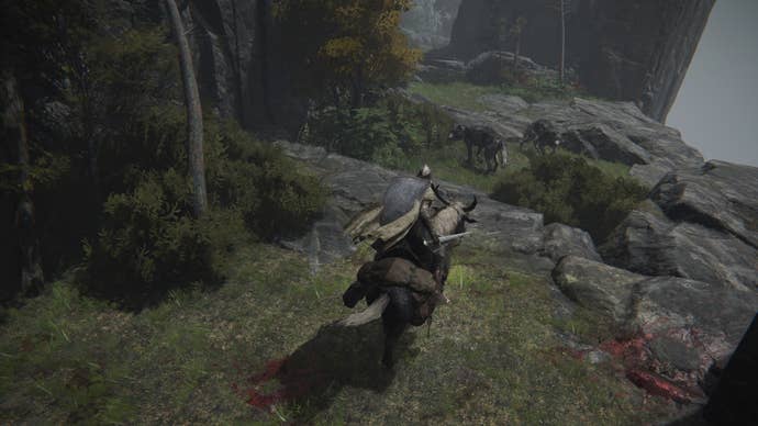The player in Elden Ring faces off against two Wolves while on horseback.