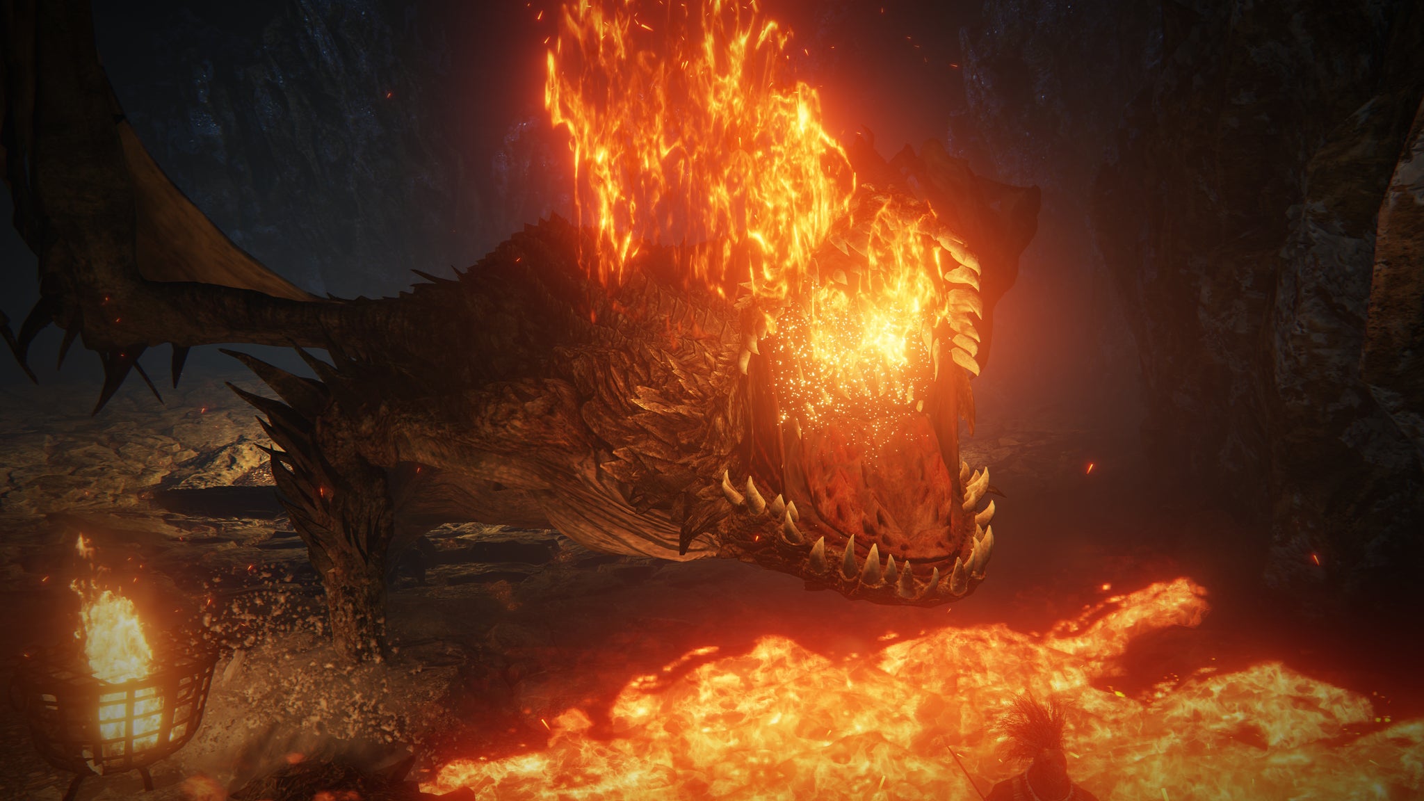 A Magma Wyrm in Elden Ring towers over the player and belches magma. - 5