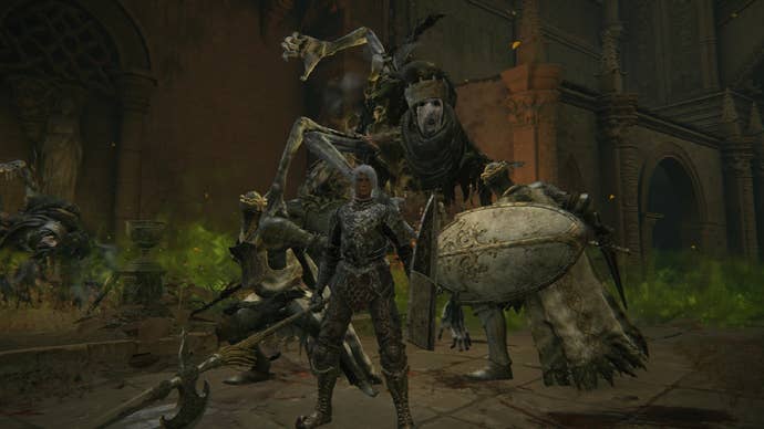 The Tarnished standing in from of a boss statue in Elden Ring.