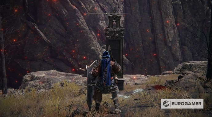 An Elden Ring character standing at the location of the Mount Gelmir map fragment.