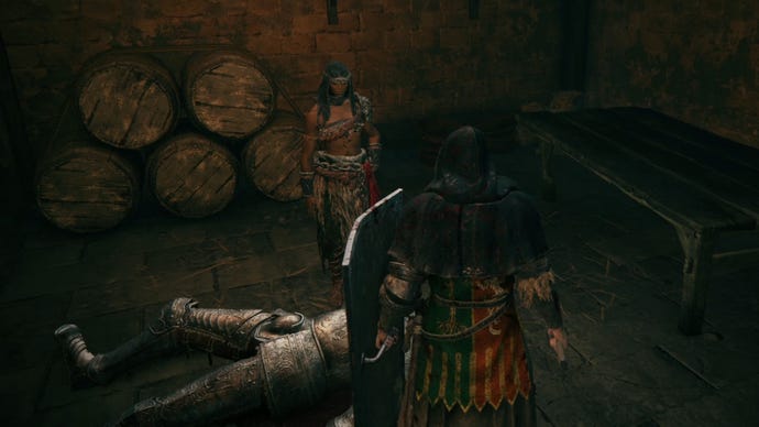 The player speaks to the warrior Nepheli Loux in Stormveil Castle in Elden Ring.