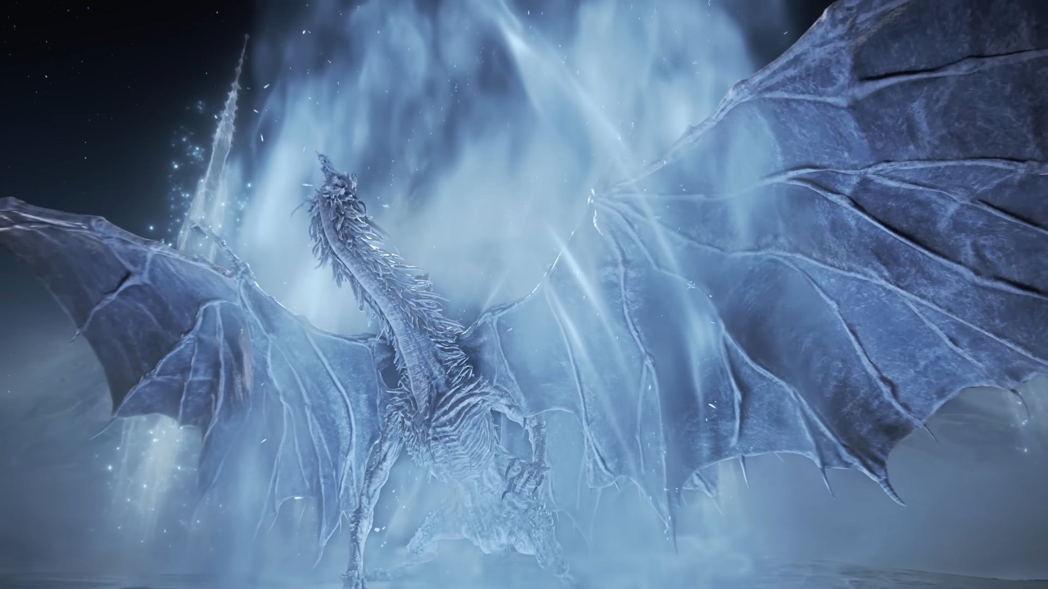 A close-up of the massive dragon Nightlord Caligo in Elden Ring: Nightreign, spreading its rings and roaring while engulfing itself in ice magic. - 8
