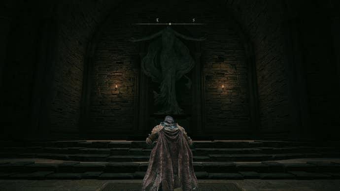 The player in Elden Ring: Shadow Of The Erdtree performs the O Mother gesture in front of a statue of Marika.