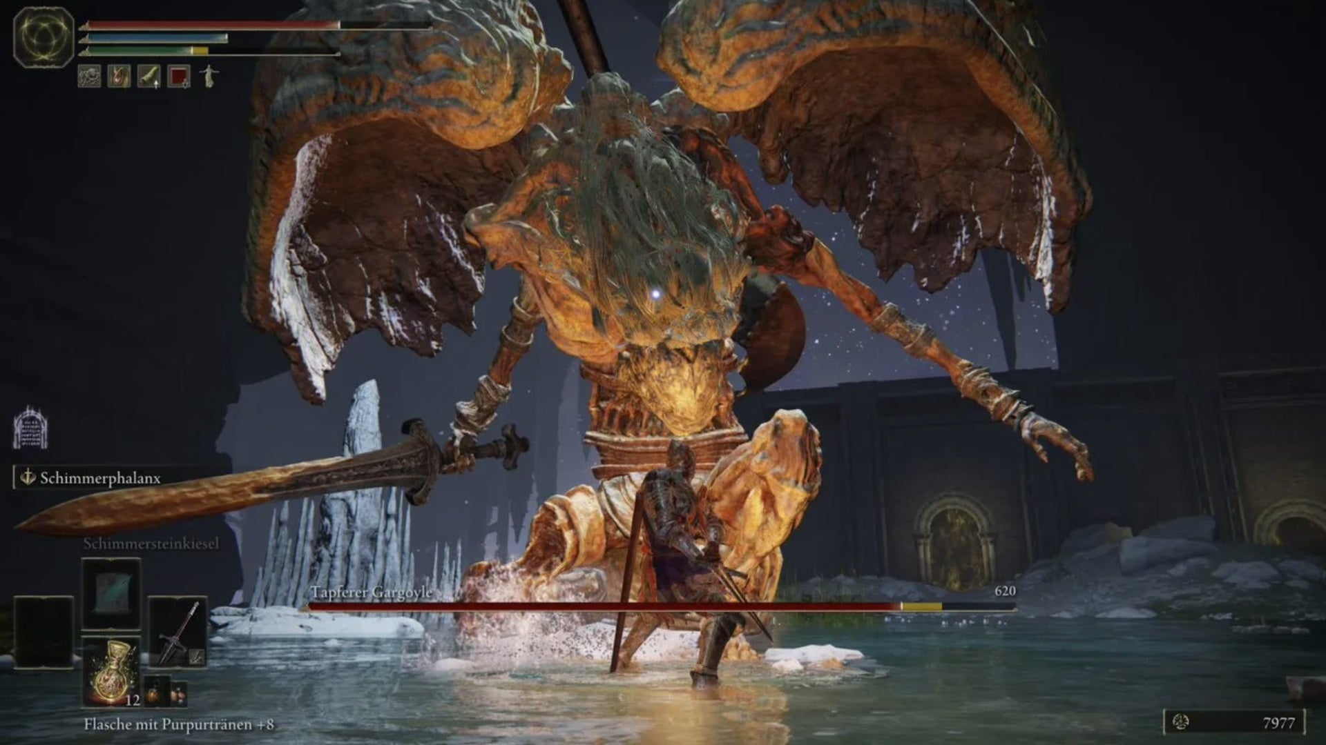 elden ring player attacking valiant gargoyle&rsquo;s legs