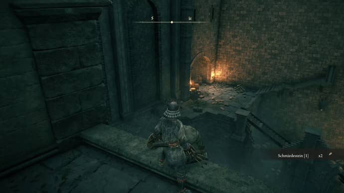 elden ring player facing castle corner lit by flame torch