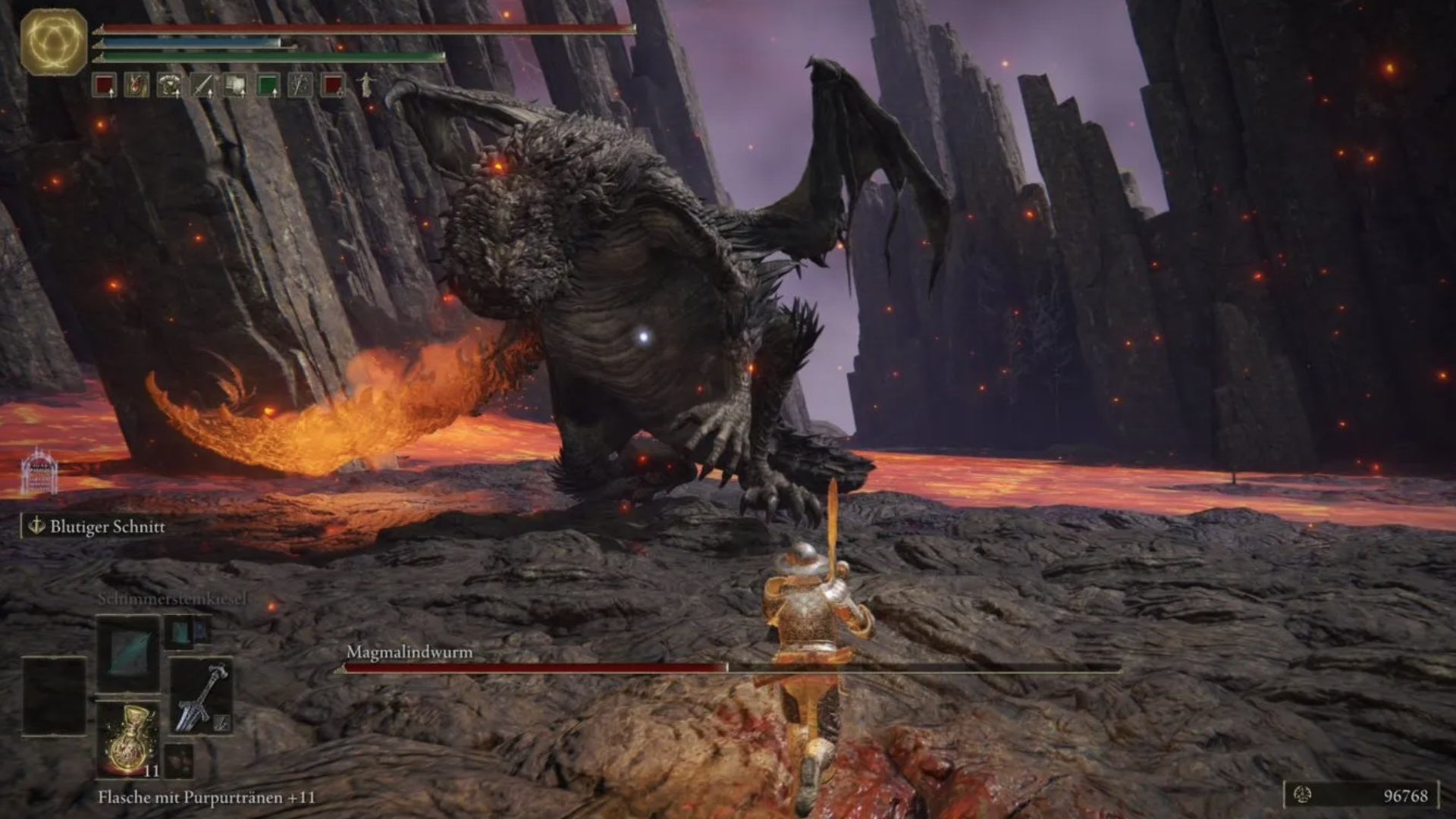 elden ring player facing fort laiedd magma worm boss on lava field