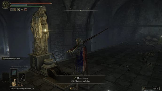 elden ring player in war dead catacombs facing statue