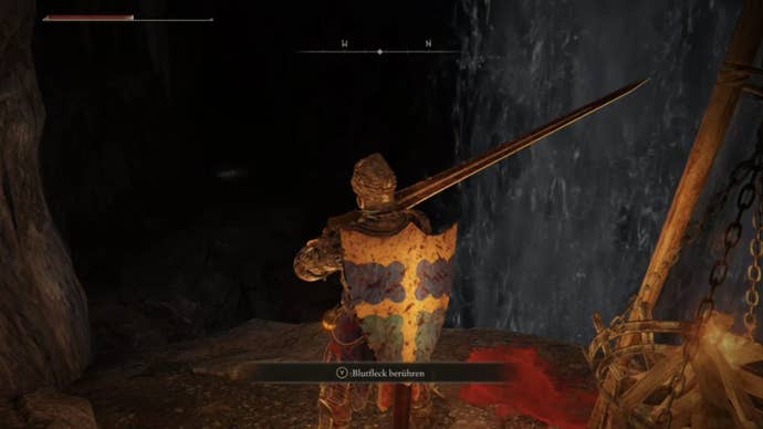 elden ring player looking at dark hole in sages cave