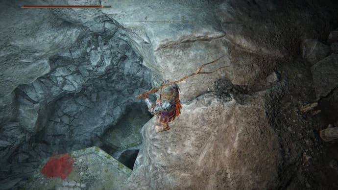 elden ring player looking down hole in highroad cave