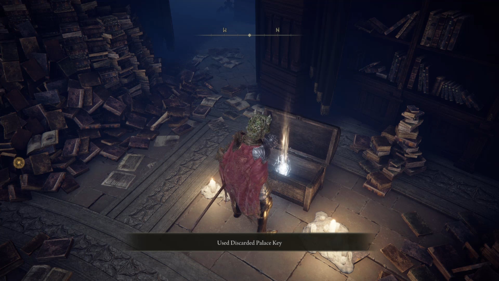 The player in Elden Ring stands in front of the opened chest in Rennala's Academy Library. - 15