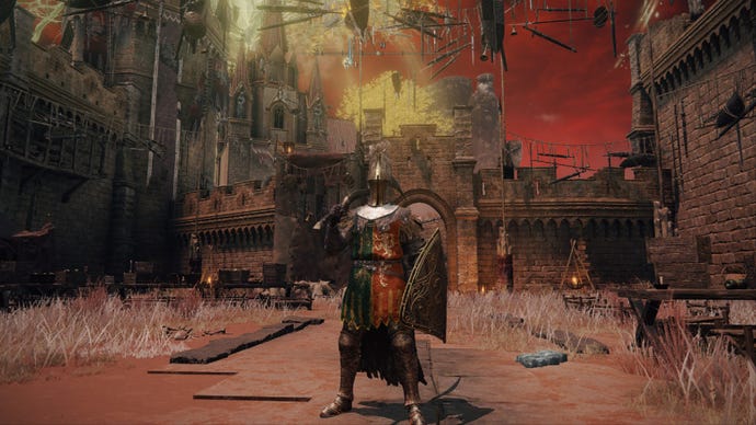 Elden Ring player standing in the centre of Redmane Castle plaza, with various bits of furniture scattered around.