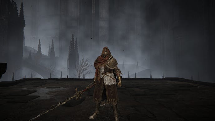 Elden Ring: Shadow Of The Erdtree screenshot of the Tarnished outside the Church District and wielding Fire Knight Queelign's Greatsword.
