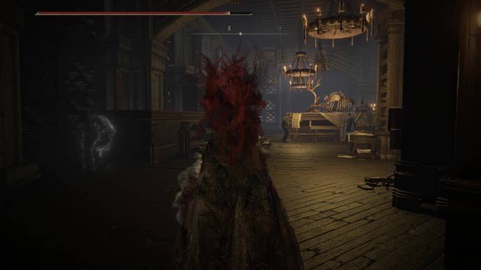 A warrior enters a long corridor with a table and animal skeleton in front of them as they travel to locate the Secret Rite Scroll for Ansbach’s questline in Elden Ring Shadow of the Erdtree.