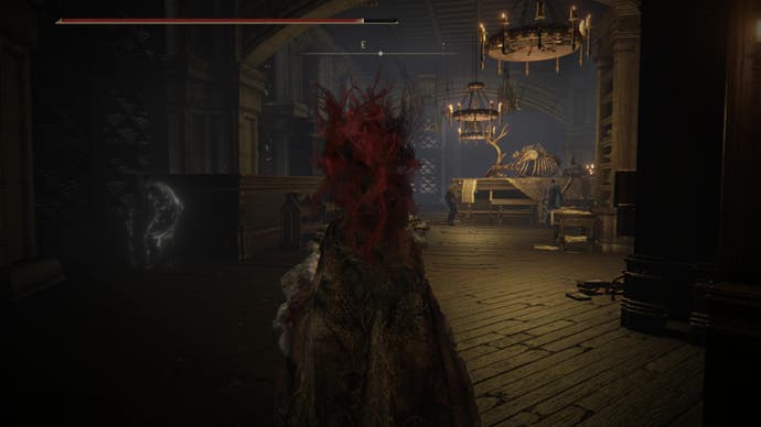 A warrior enters a long corridor with a table and animal skeleton in front of them as they travel to locate the Secret Rite Scroll for Ansbach's questline in Elden Ring Shadow of the Erdtree.