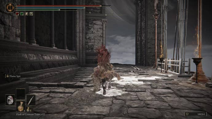 A warrior runs past a staircase in Elden Ring Shadow of the Erdtree.