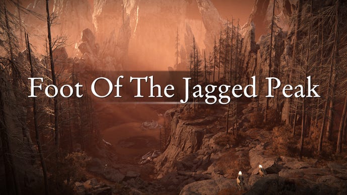 An establishing shot of the region of the Foot Of The Jagged Peak in Elden Ring: Shadow Of The Erdtree, with the region's name emblazoned across the screenshot.