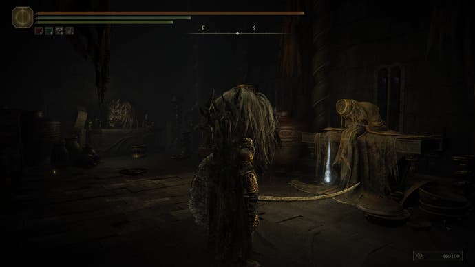 A warrior wearing a lion's head approaches the Hornsent Grandam slumped on a table in Elden Ring Shadow of the Erdtree.