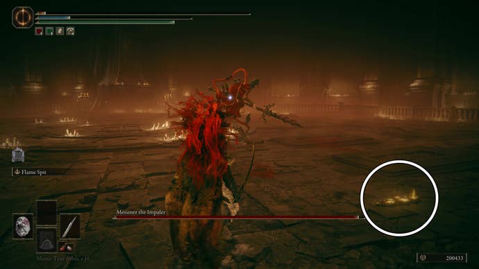 A warrior fights Messmer the Impaler, with a white and black circle highlighting Hornsent’s summoning tablet inside the boss arena in Elden Ring Shadow of the Erdtree.