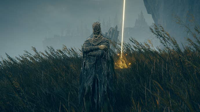 Elden Ring: Shadow Of The Erdtree screenshot of the Hornsent NPC next to a Cross of Miquella in the Lands of Shadow.