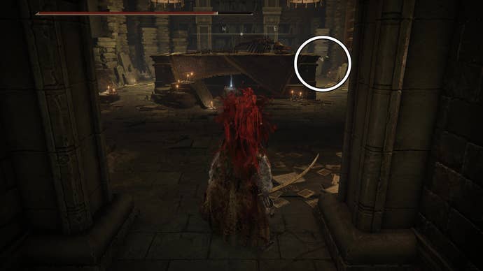 A warrior enters a room with a large bone carcass on a table, with a white circle highlighting Ansbach’s location inside the Shadow Keep in Elden Ring Shadow of the Erdtree.