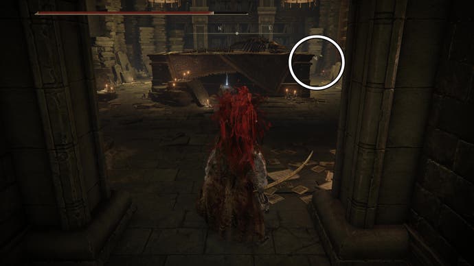 A warrior enters a room with a large bone carcass on a table, with a white circle highlighting Ansbach's location inside the Shadow Keep in Elden Ring Shadow of the Erdtree.