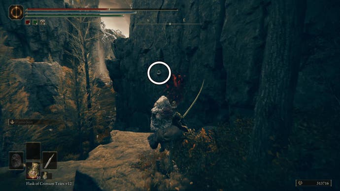 A warrior rides toward the edge of a cliff where an urn holding the String Seller's Bell Bearing is strung up on the wall, highlighted by a white circle, in Elden Ring Shadow of the Erdtree.