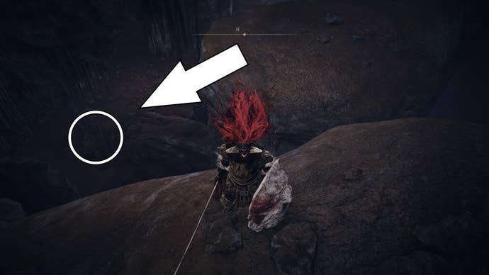 A warrior stands on a ledge where a white arrow and circle highlights the location of the Mass of Putrescence Sorcery spell in Elden Ring Shadow of the Erdtree.