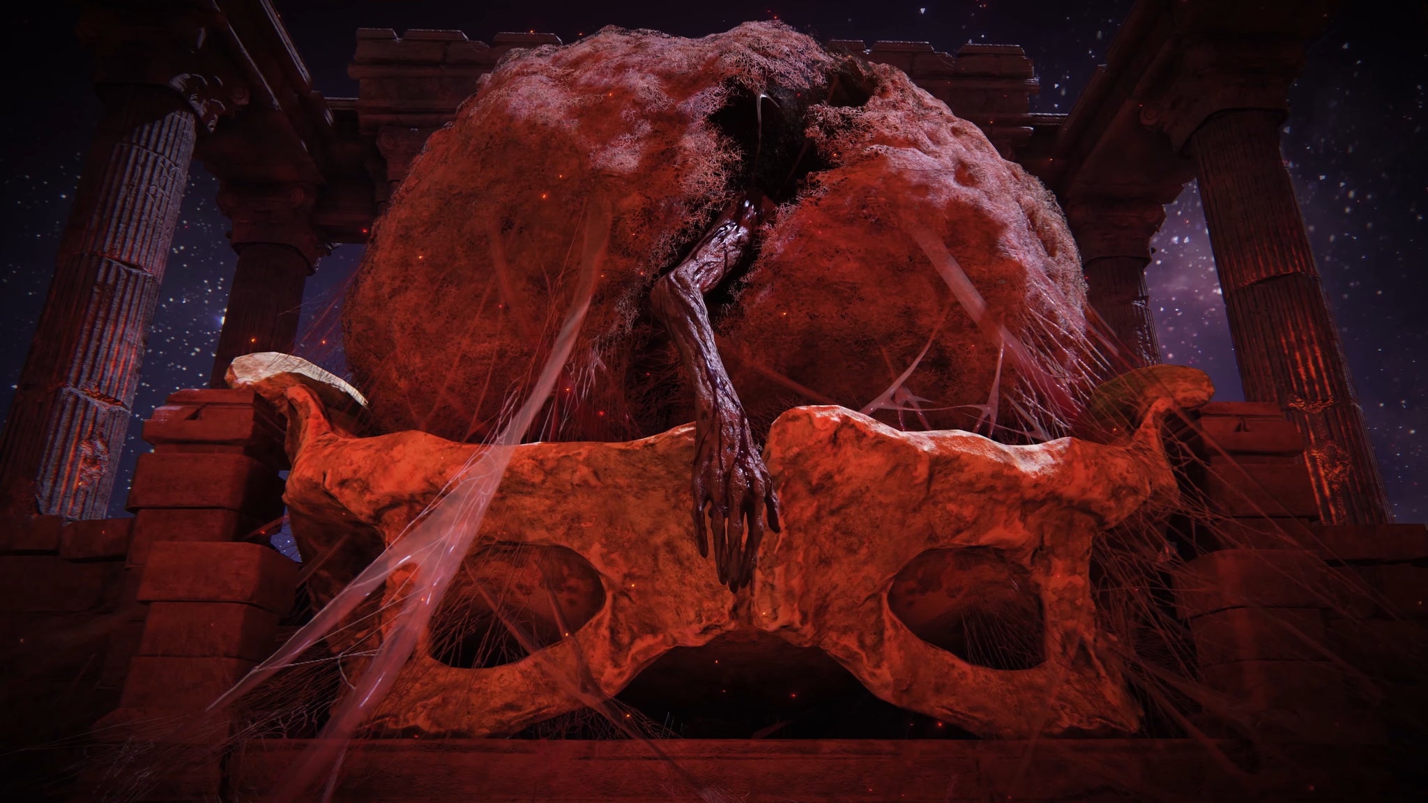 A close-up of a withered hand hanging from the cocoon in Mohg's arena in the Shadow Of The Erdtree trailer. - 5