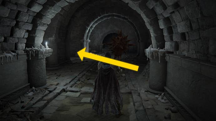 The player in Elden Ring: Shadow Of The Erdtree makes their way through the Fog Rift Catacombs, with a yellow arrow pointing towards the location of the hidden Altar.