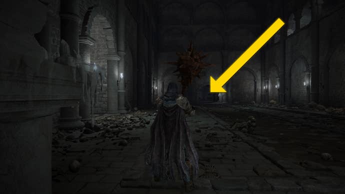 The player in Elden Ring: Shadow Of The Erdtree makes their way through the Fog Rift Catacombs, with a yellow arrow pointing towards the location of the hidden Altar.