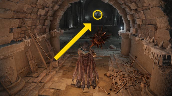 The player in Elden Ring: Shadow Of The Erdtree makes their way through the Fog Rift Catacombs, with a yellow arrow pointing towards the location of the hidden Altar.