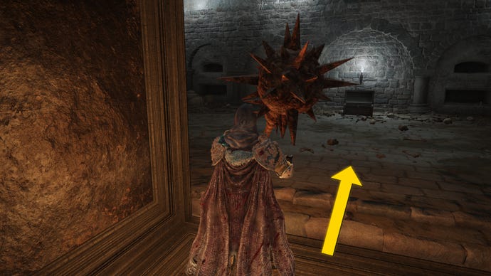 The player in Elden Ring: Shadow Of The Erdtree makes their way through the Fog Rift Catacombs, with a yellow arrow pointing towards the location of the hidden Altar.