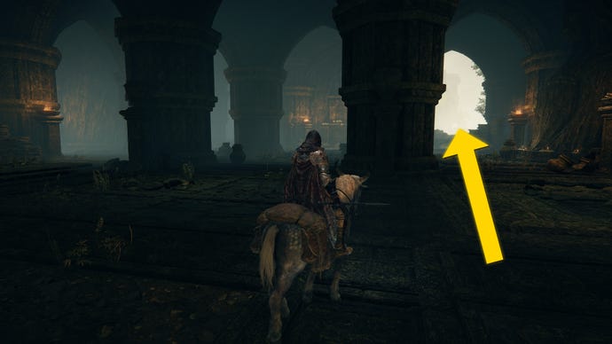 The player in Elden Ring: Shadow Of The Erdtree rides their horse through an indoor area of Rauh Ancient Ruins.
