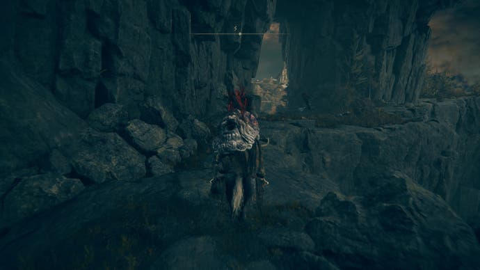 A warrior rides their horse down a cliff path to Prospect Town in Gravesite Plain in Elden Ring Shadow of the Erdtree.