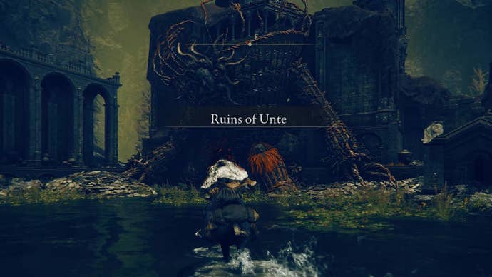 A warrior approaches a fallen Furnace Golem in the Ruins of Unte in Elden Ring Shadow of the Erdtree.