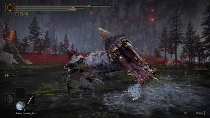 A warrior fights a large hippo in Charo’s Hidden Grave in Elden Ring Shadow of the Erdtree.