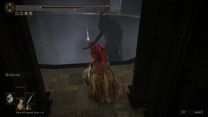 A warrior approaches a Scadutree Fragment on the top of a statue in the Shadow Keep in Elden Ring Shadow of the Erdtree.