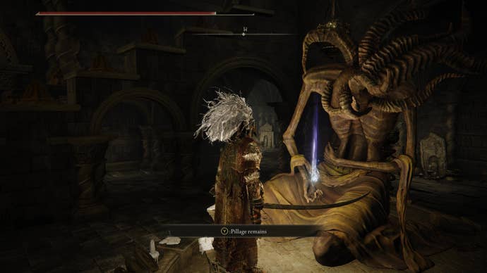 A warrior approaches a glowing orb on a statue in Belurat, Tower Settlement in Shadow of the Erdtree.