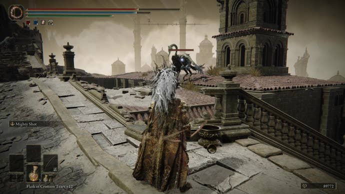 A warrior looks at bird enemies on rooftops in Belurat, Tower Settlement in Shadow of the Erdtree