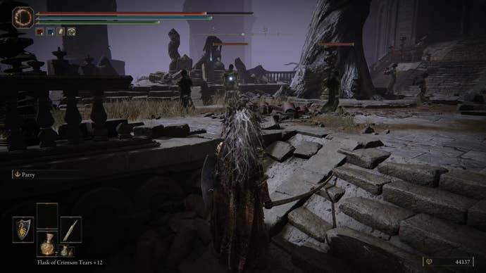 A warrior approaches a group of ghostly shades in Belurat, Tower Settlement in Shadow of the Erdtree