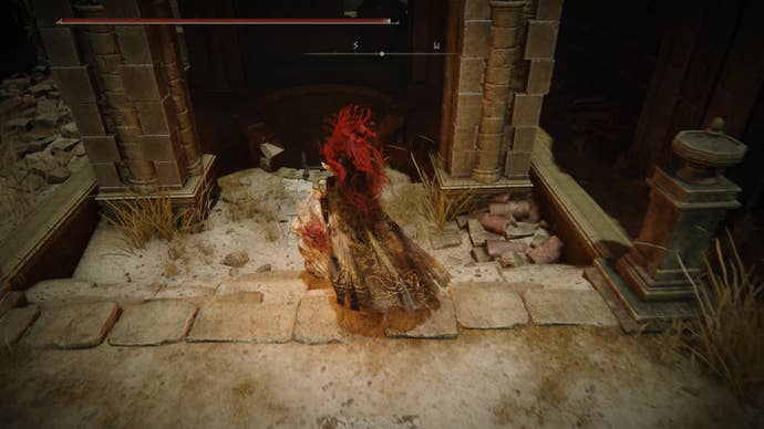 A warrior runs towards a well in Belurat, Tower Settlement in Shadow of the Erdtree