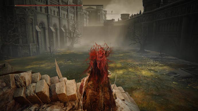 A warrior looks out over a large poison pool in Belurat, Tower Settlement in Shadow of the Erdtree