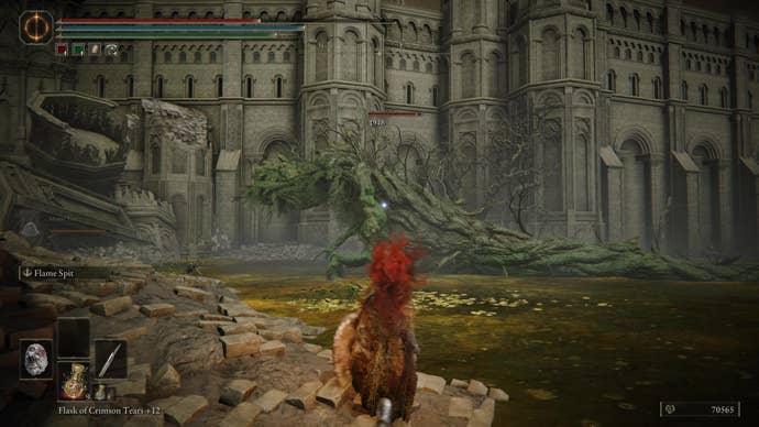 A warrior looks at a large tree spirit in Belurat, Tower Settlement in Shadow of the Erdtree