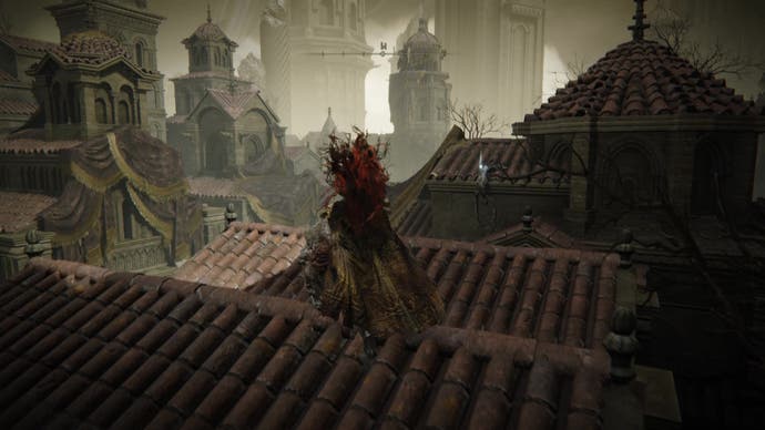 A warrior clambers over rooftops to reach a corpse in Belurat, Tower Settlement in Shadow of the Erdtree.